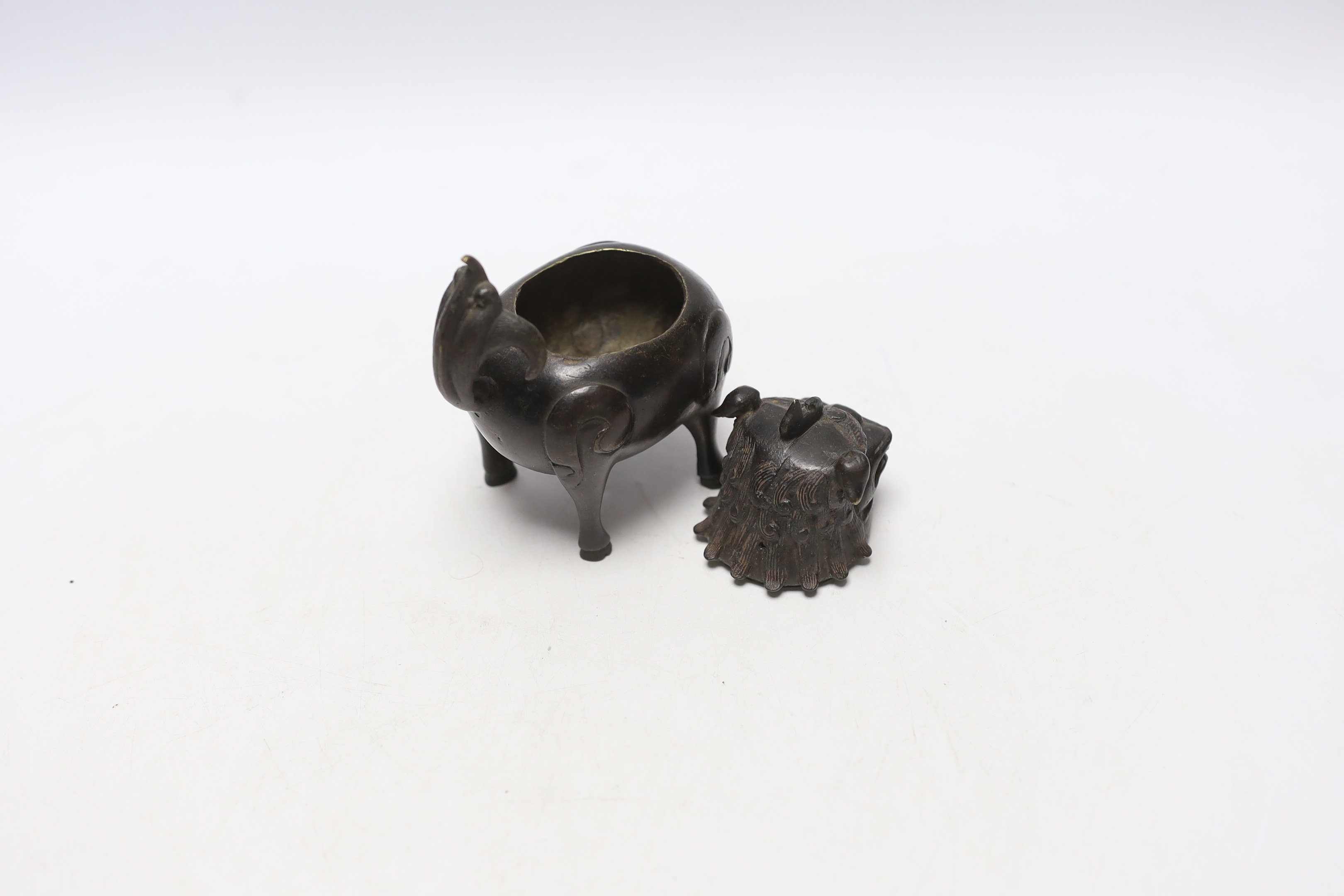 A Chinese bronze mythical beast censer and cover (Luduan), 17th century, the cover with pierced mouth, 9cm in length